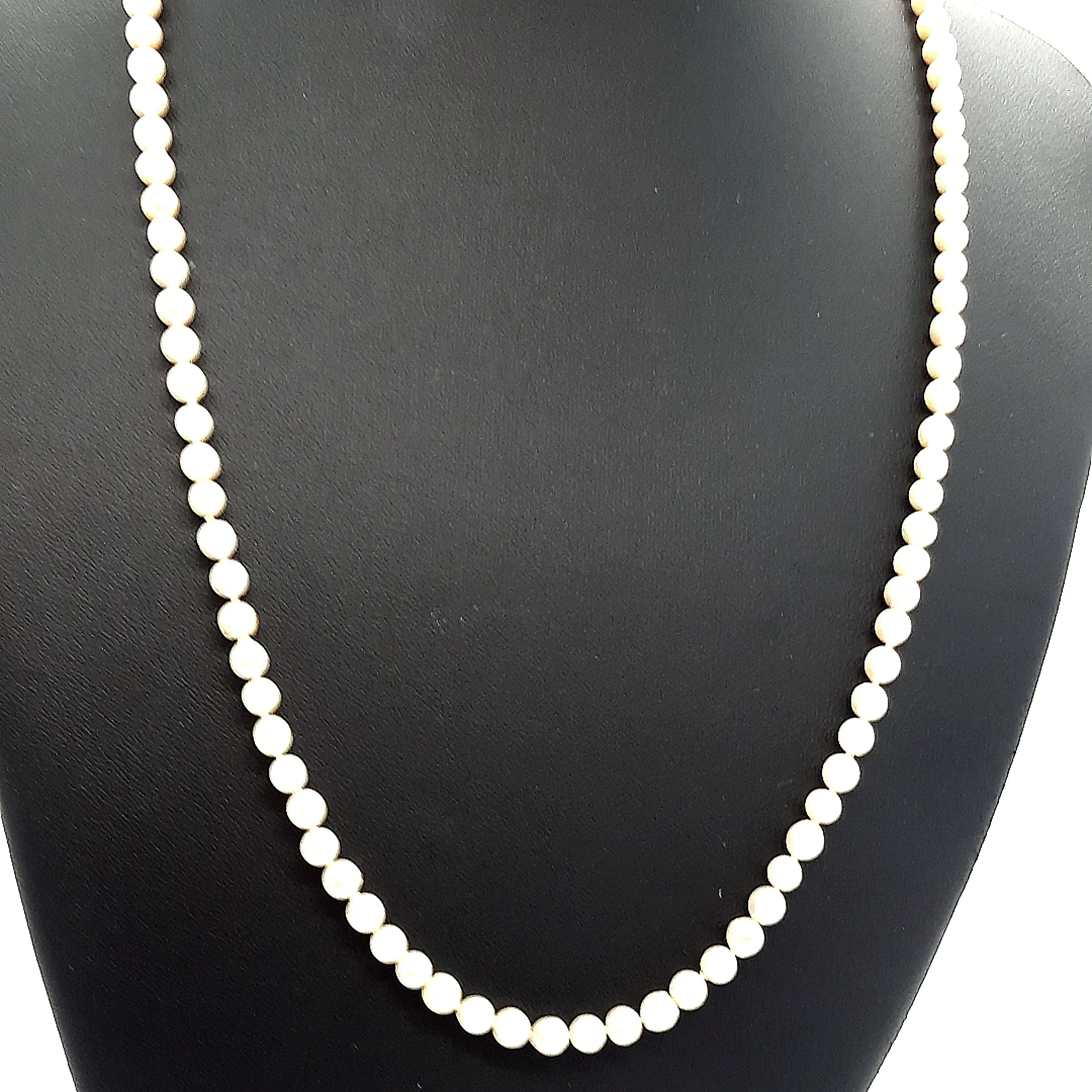 Strand of 99 Cultured Pearls with a Yellow Gold Albert Swivel Clasp